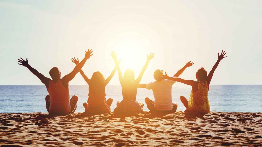 people sitting on the beach